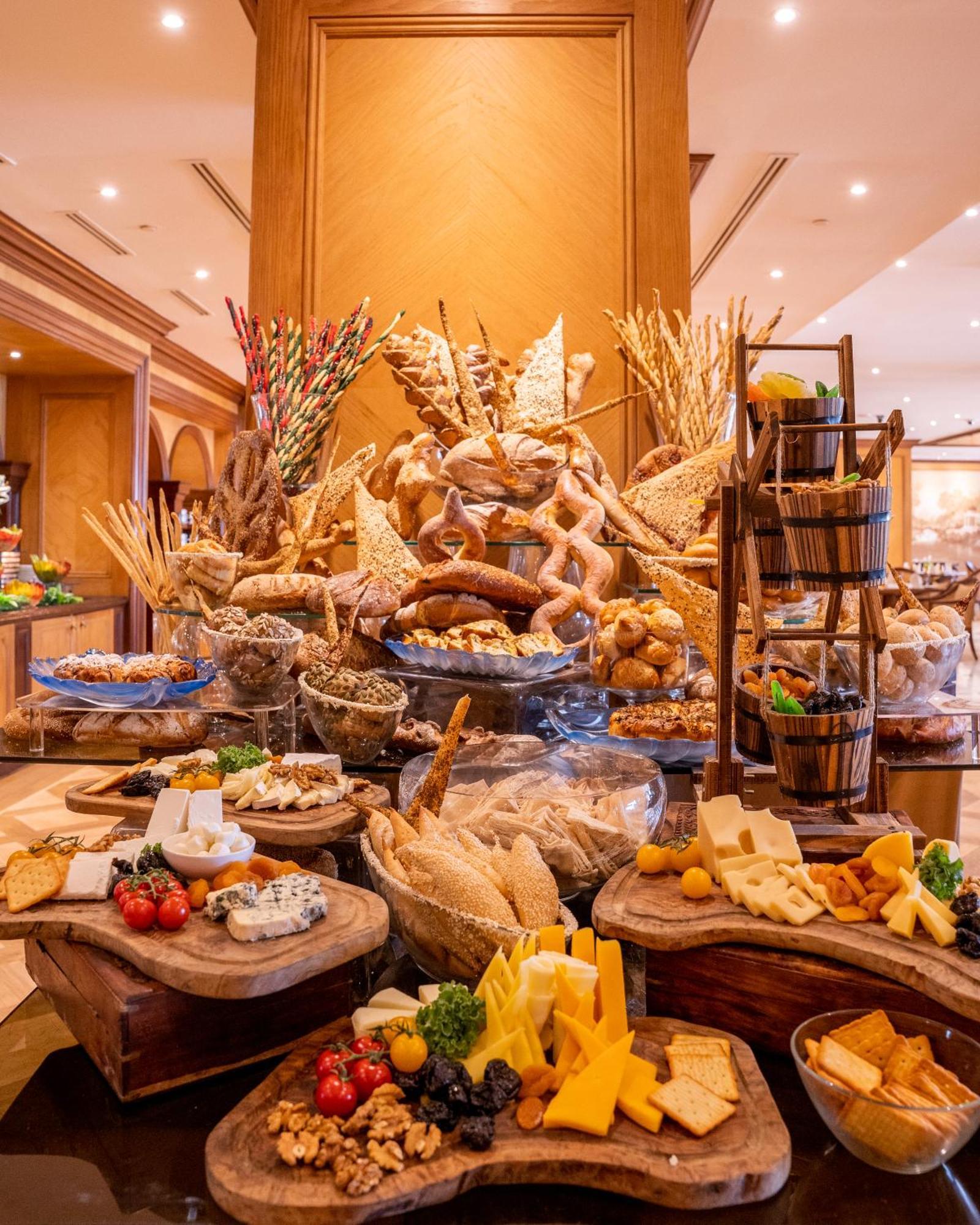 The Regency Hotel Kuwait Kuwait City Eksteriør bilde A cheese display at a buffet